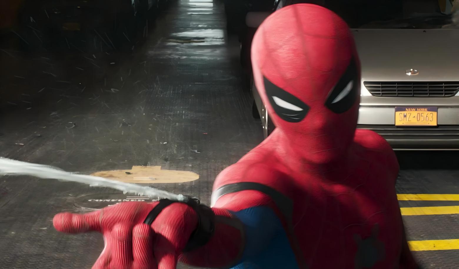 What does Spider-Man use to swing between buildings?